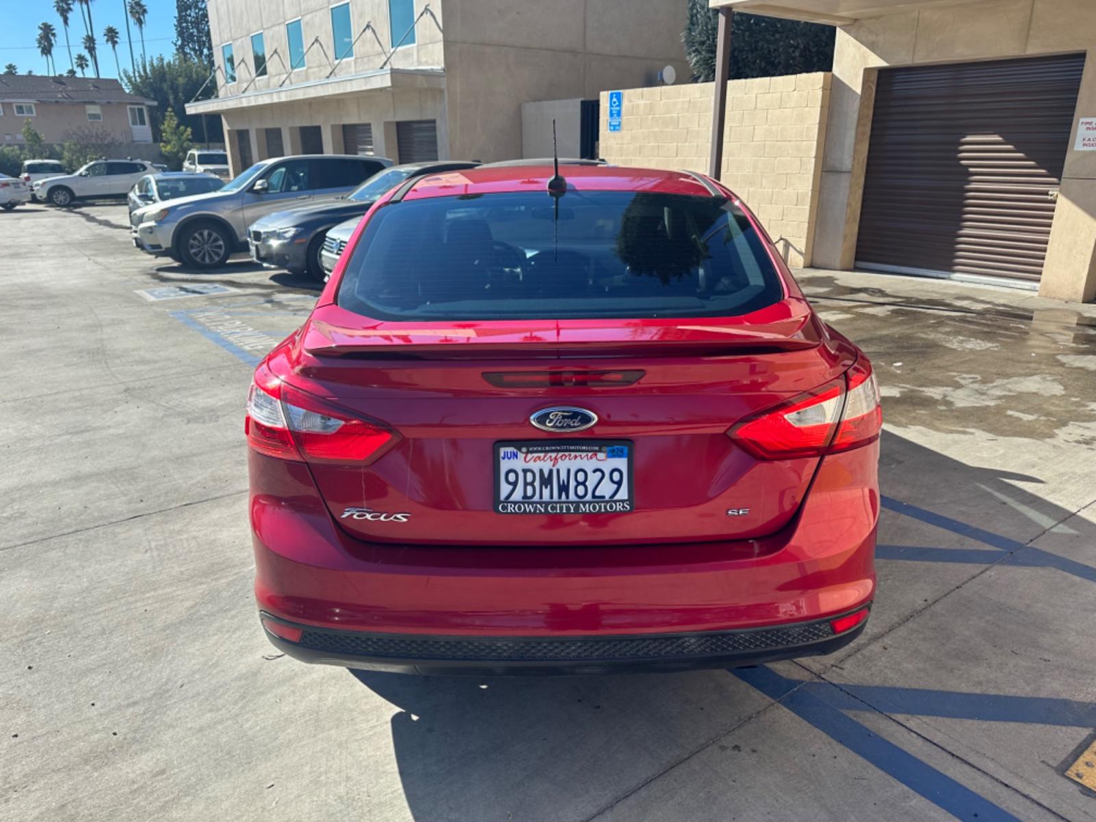 2012 RED /BLACK Ford Focus SE Sedan (1FAHP3F29CL) with an 2.0L L4 DOHC 16V engine, AUTOMATIC transmission, located at 30 S. Berkeley Avenue, Pasadena, CA, 91107, (626) 248-7567, 34.145447, -118.109398 - New Tires! Nice Interior! drives and looks good! Bad credit? We can help! We are the bank. All our cars are thoroughly inspected and reconditioned by our technicians. FREE CARFAX report. Stop by or call to speak with our friendly staff. Whether you have bad credit, no credit, bankruptcy, or reposse - Photo #3